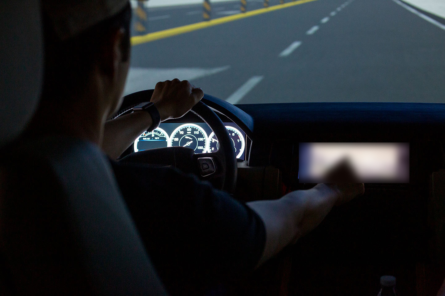 A participant in a simulated driving user test